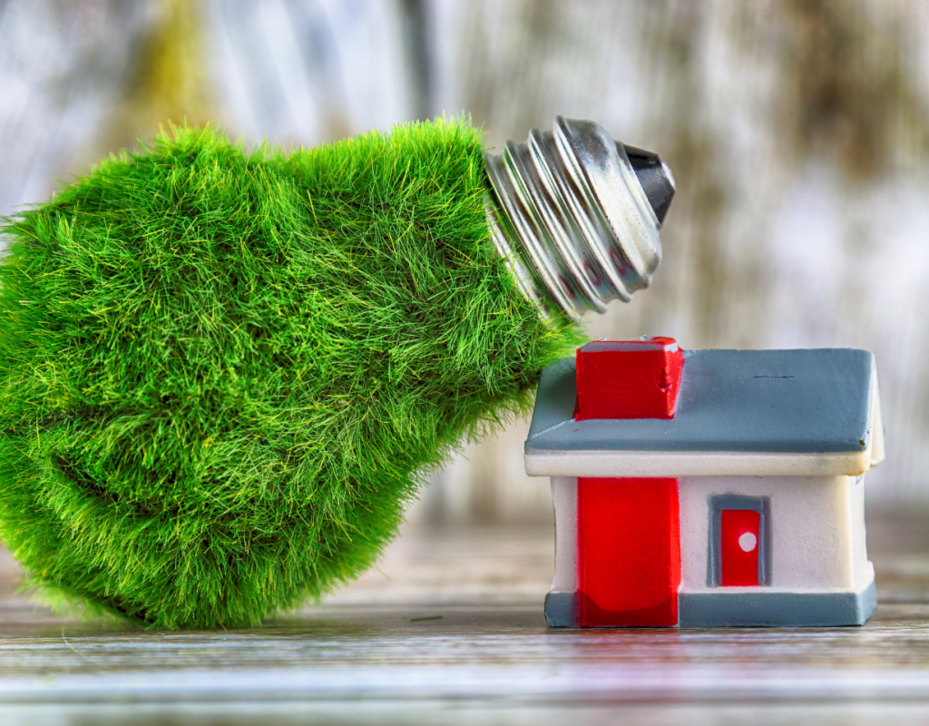 Green Lightbulb Covered In Grass By Toy Home